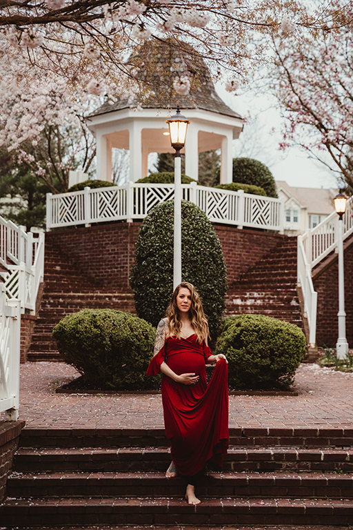 gorgeous mama to be in cherry blossoms Virginia