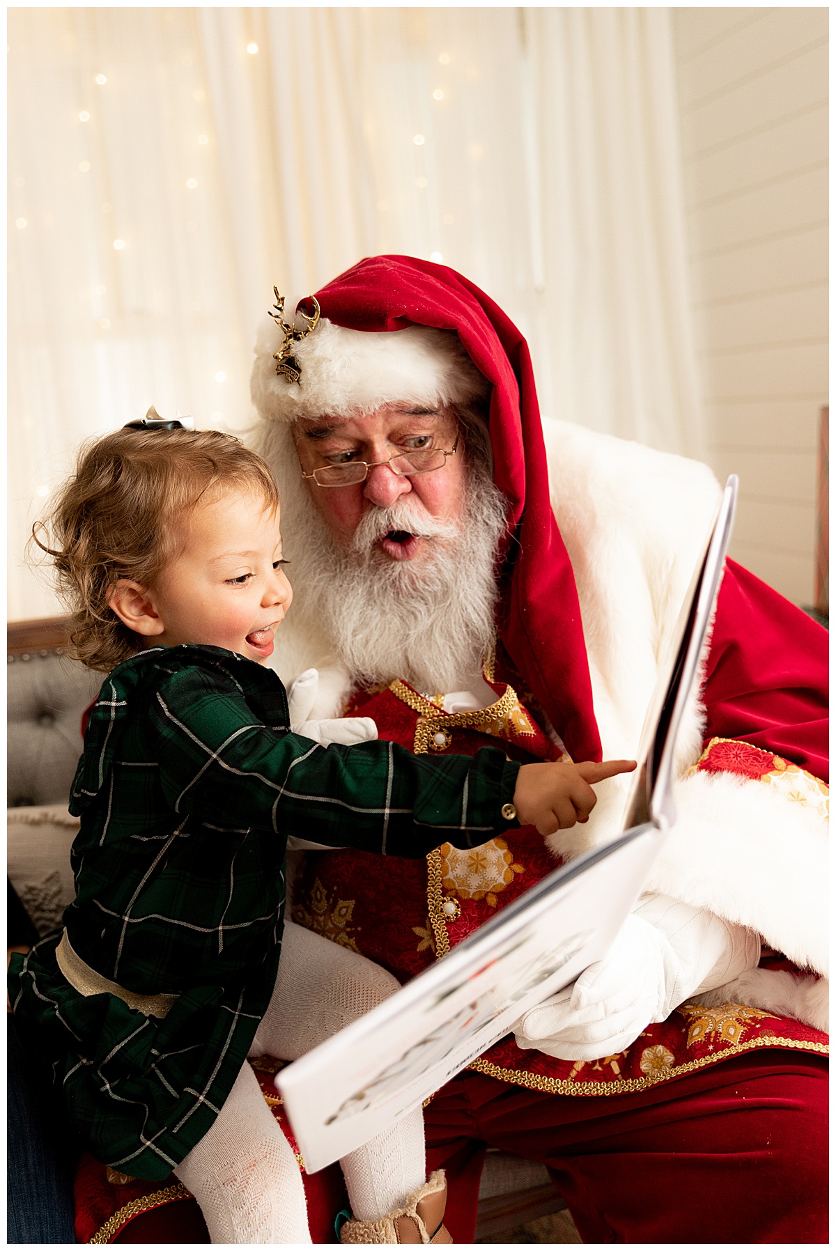 Little baby pointing with Santa for Washington DC Family Photographer