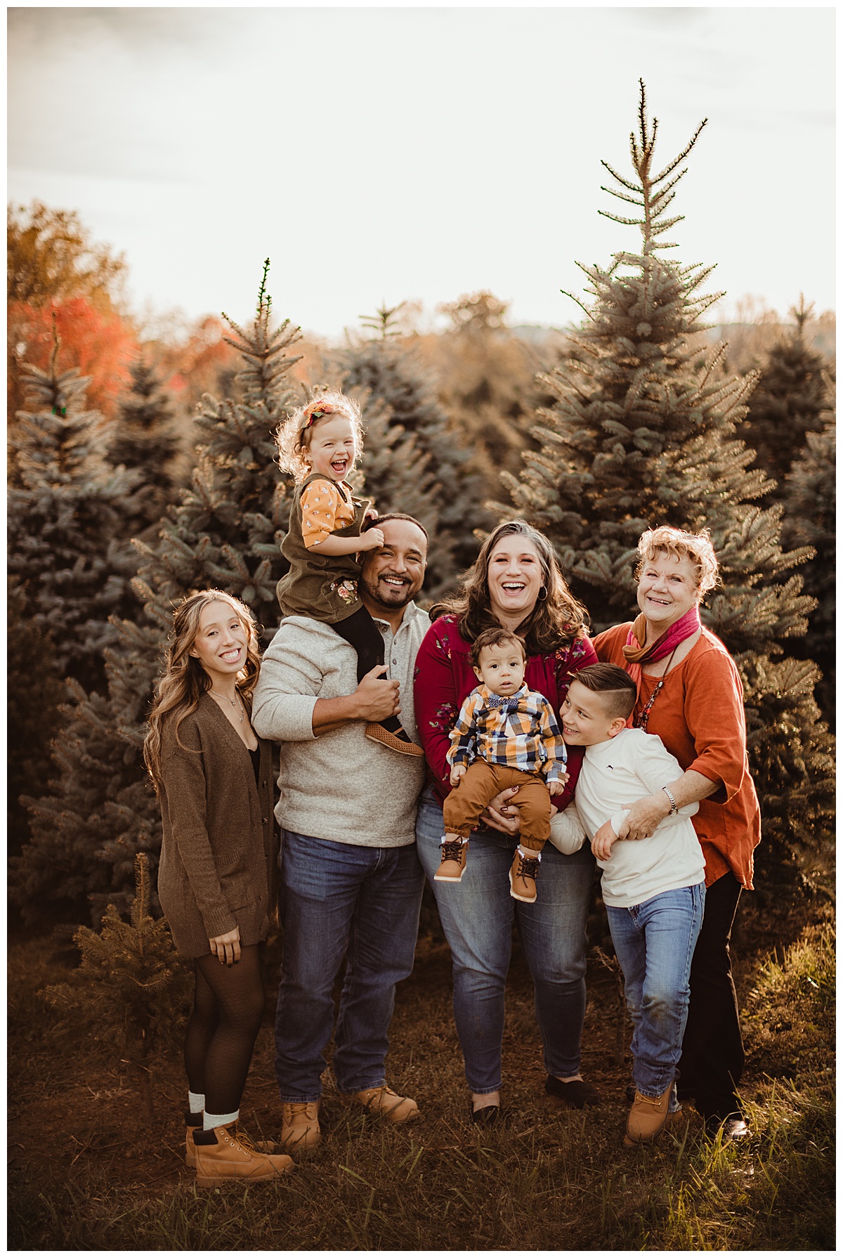 Family in front if trees by Norma Fayak Photography