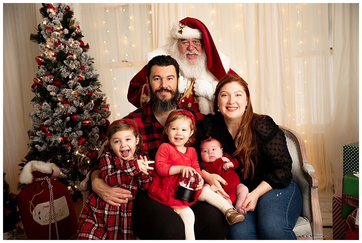 Family with three girls and Santa by Washington DC Family Photographer