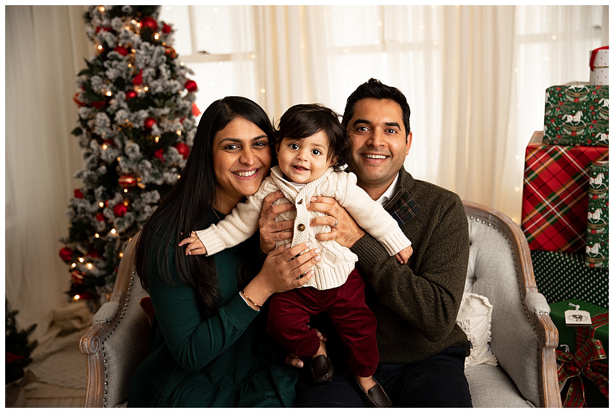 Two adults holding up baby for Washington DC Family Photographer