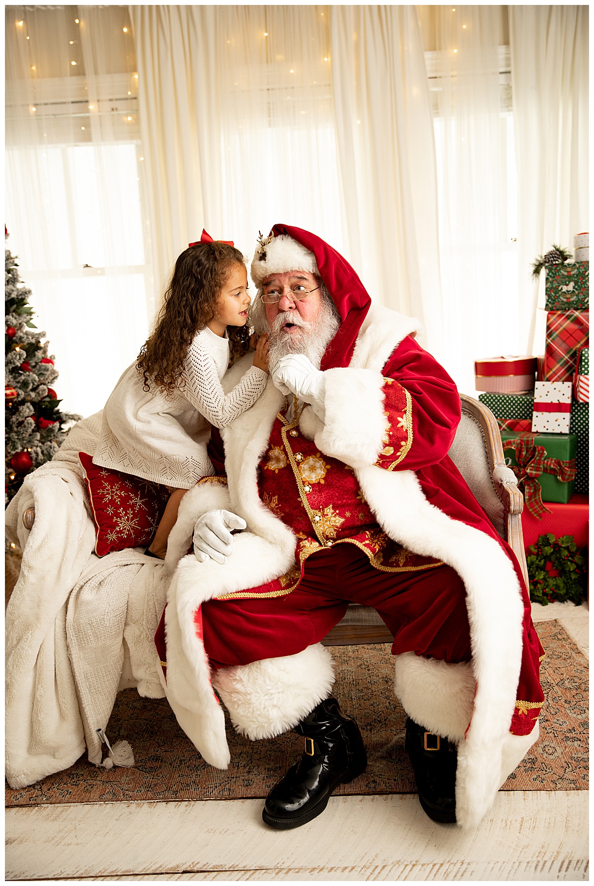Girl whispering in Santa's ear by Washington DC Family Photographer