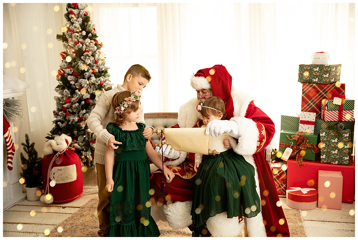 Kids and Santa reading a list by Washington DC Family Photographer