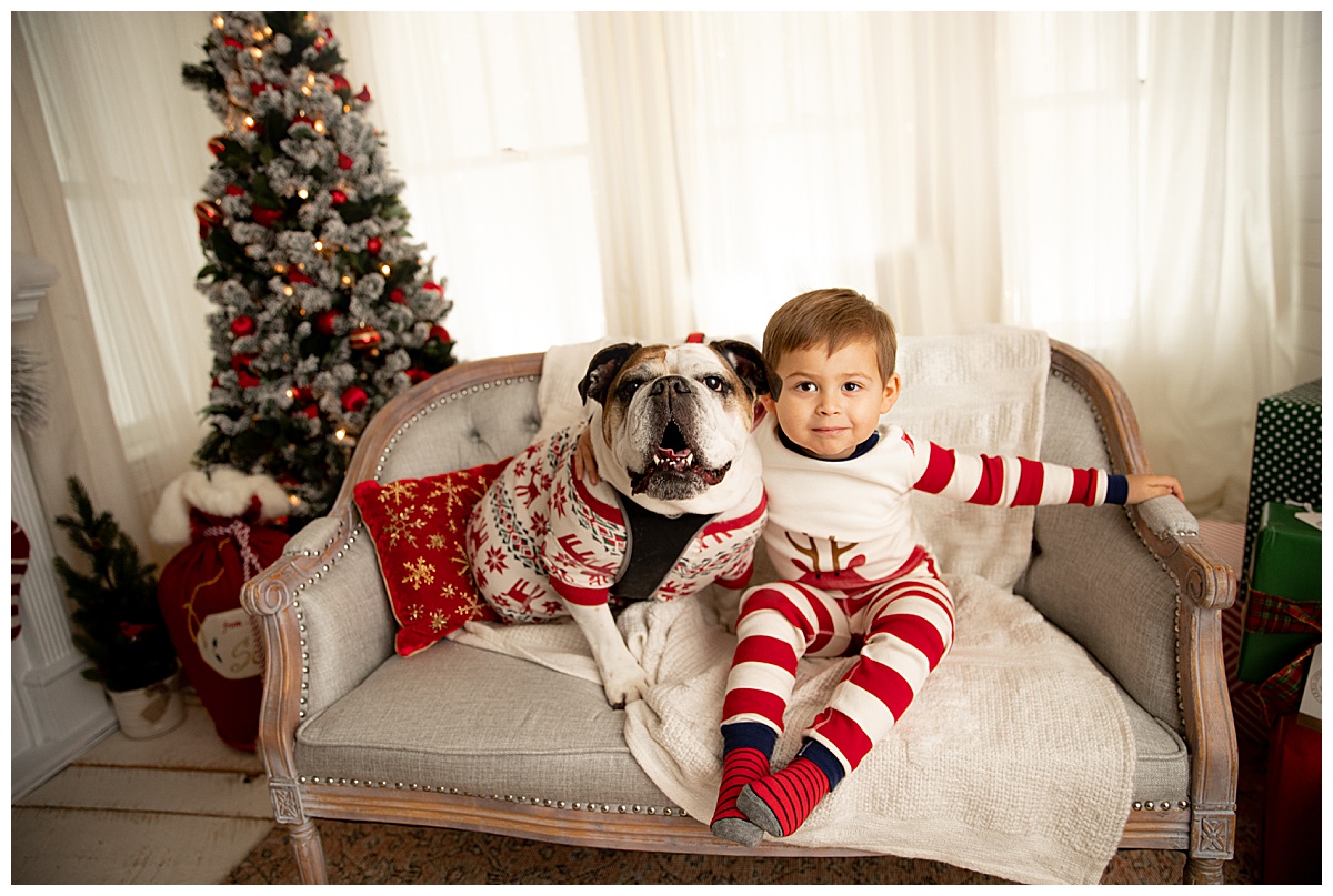 Child and dog on couch by Norma Fayak Photography