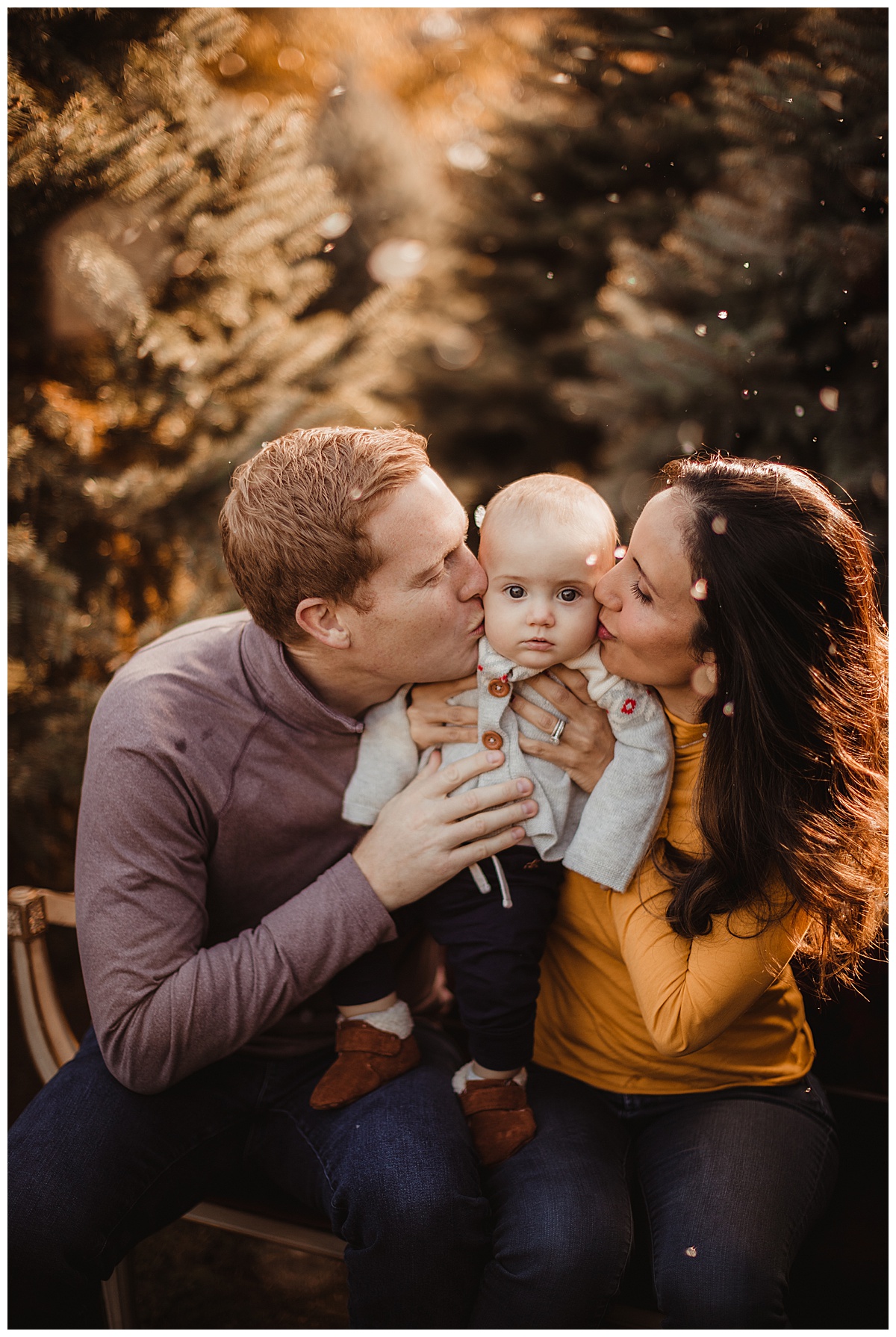 Parents hugging baby by Washington DC Family Photographer