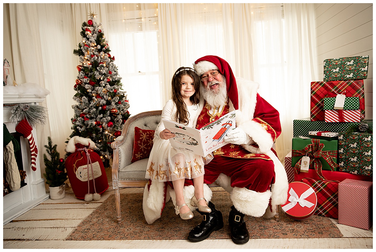 Santa reading a book with child by Washington DC Family Photographer