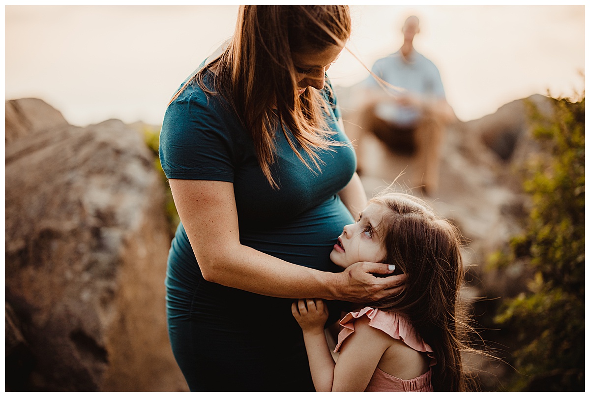 Mom holds on to daughter for Washington DC Maternity Photographer 
