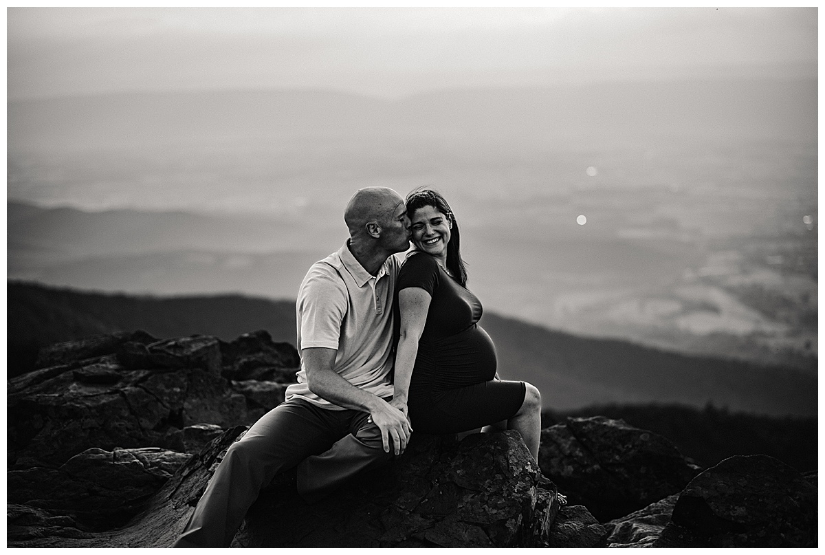 Dad kissing mom for Washington DC Maternity Photographer 
