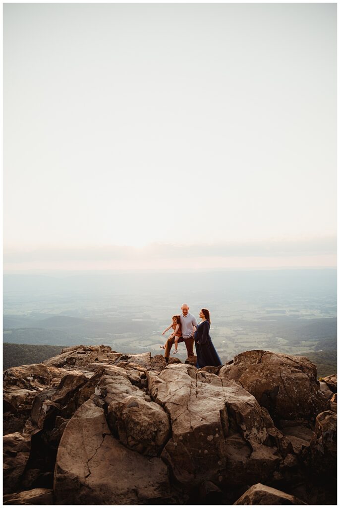 Family stand on mountain top at Shenandoah Mountains