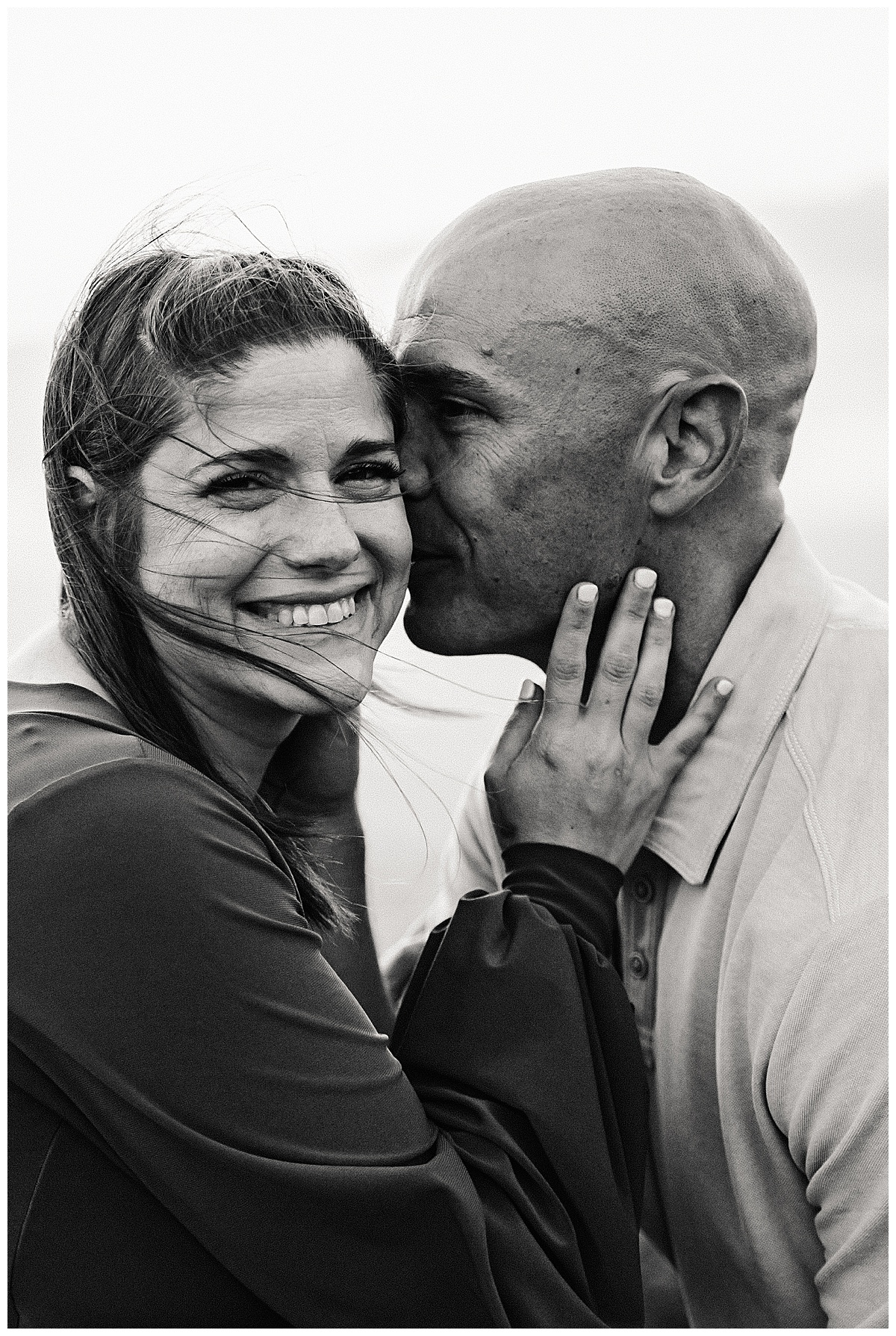 Husband kisses wife for Washington DC Maternity Photographer 