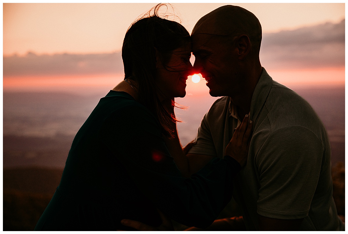 Husband and wife embrace at sunset for Norma Fayak Photography