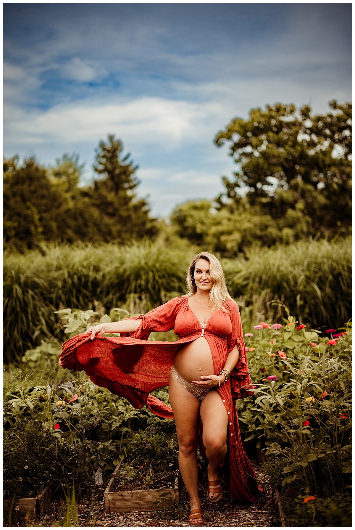Woman swaying dress and holding belly for Washington DC Maternity Photographer