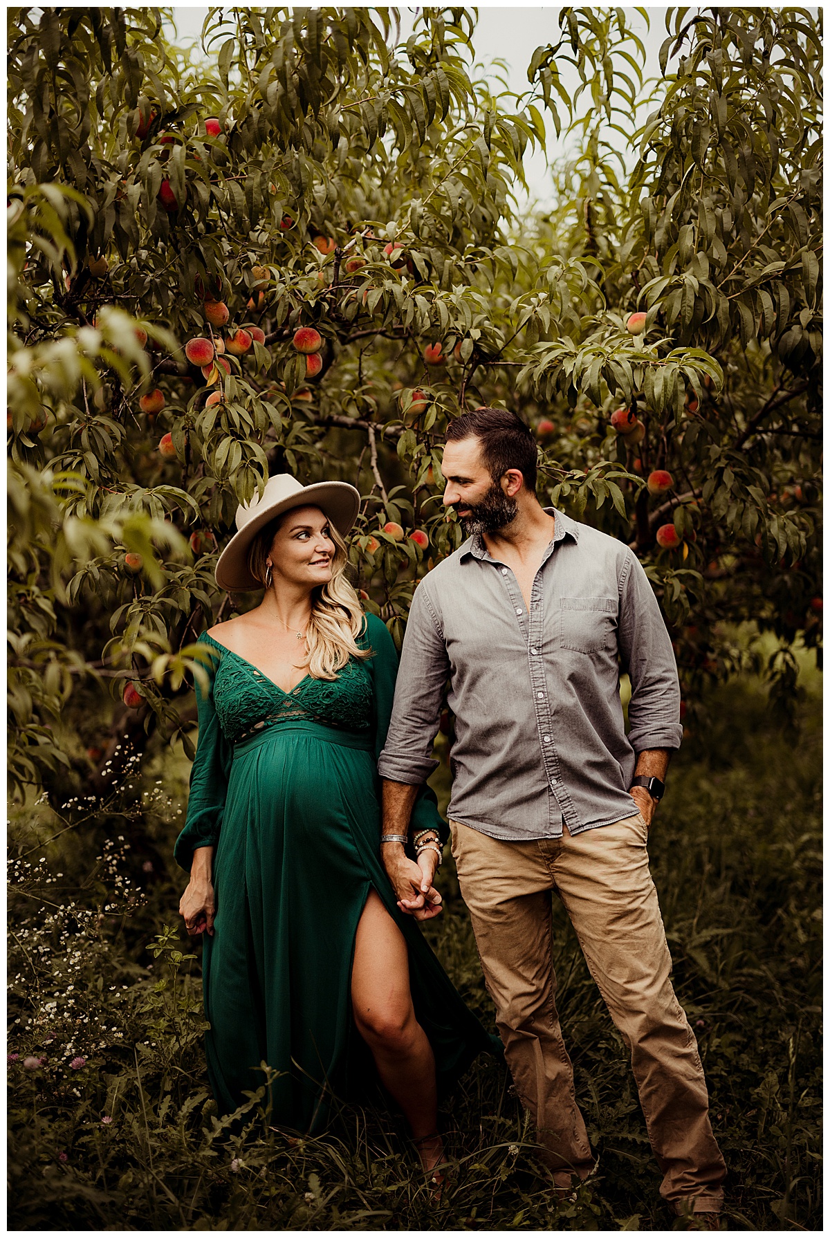 Couple looking at each other with smiles by Washington DC Maternity Photographer