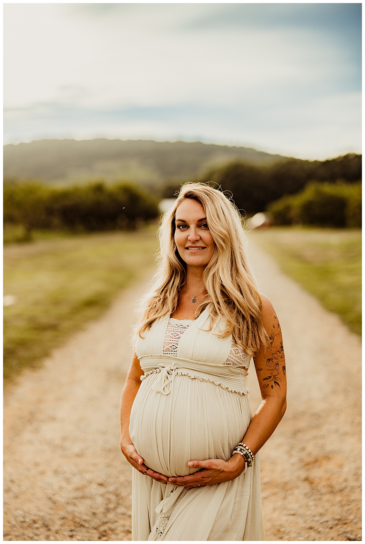 Mom smiling in road for Washington DC Maternity Photographer