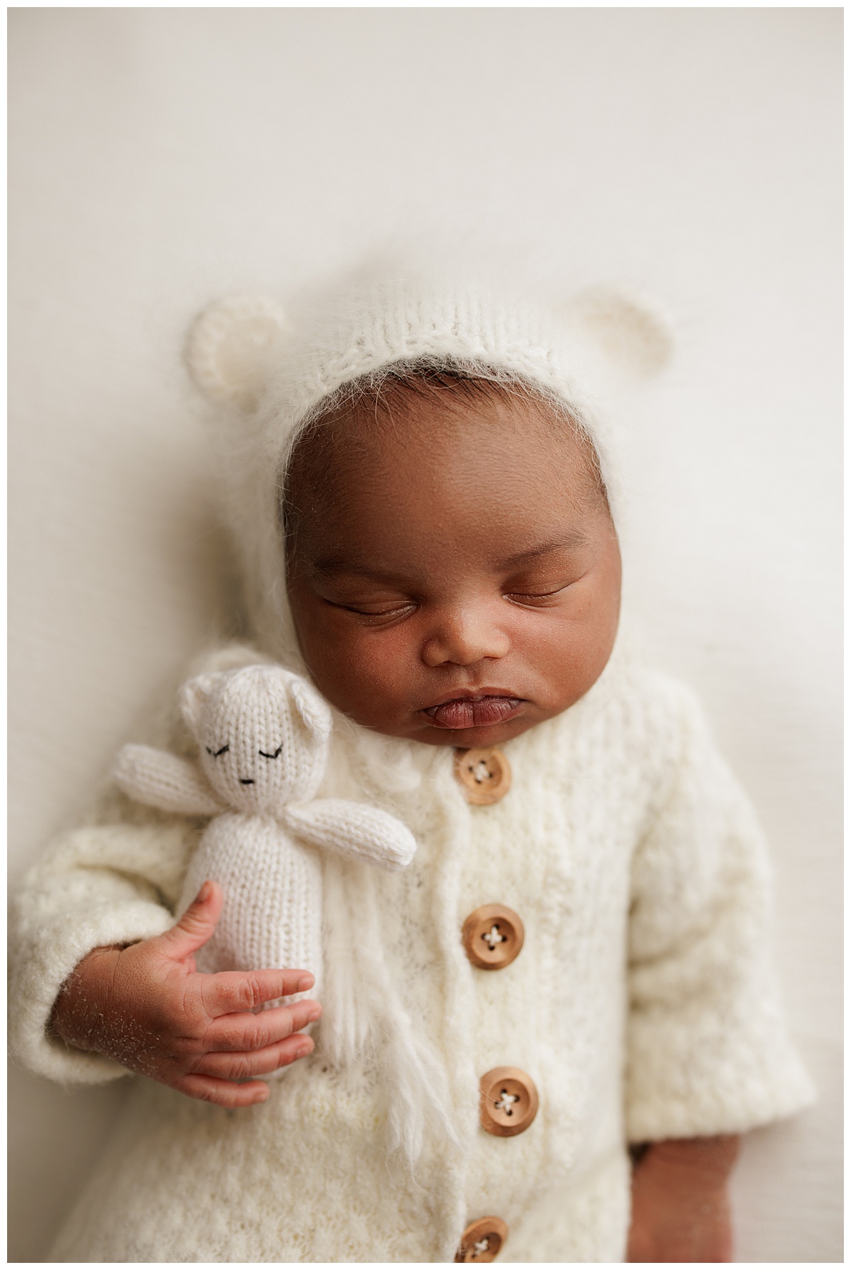 Cuddling bear baby is sleeping for Washington DC Newborn Photographer