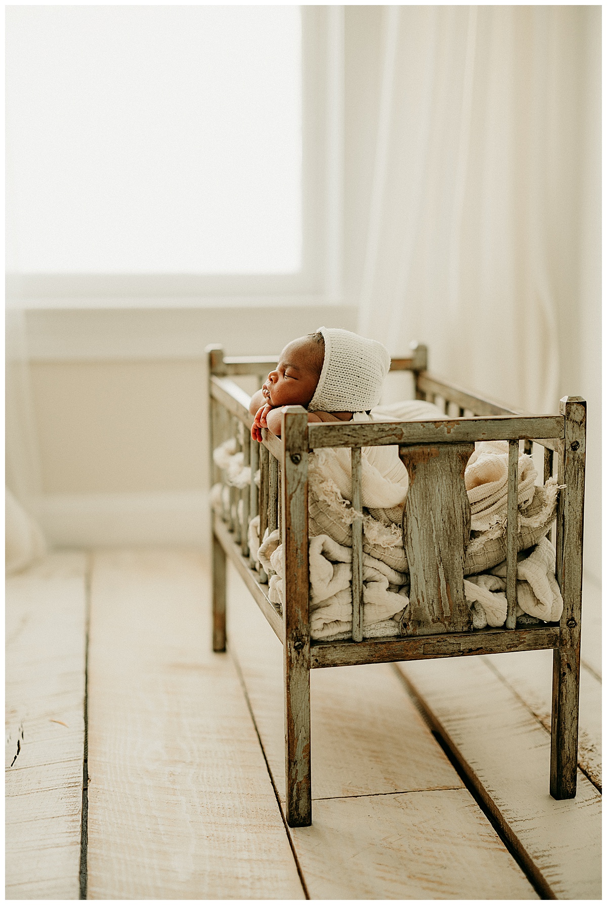 Newborn baby in bassinet for Washington DC Newborn Photographer