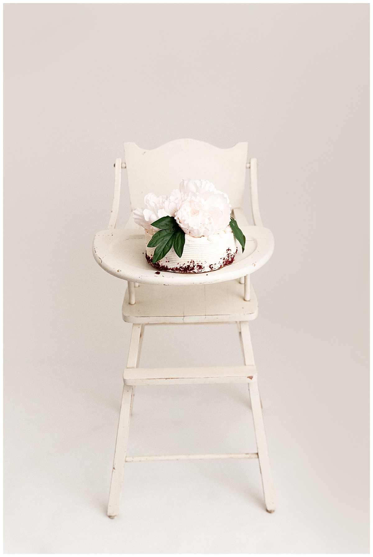 Smash cake sitting in high chair for Washington DC Baby Photographer