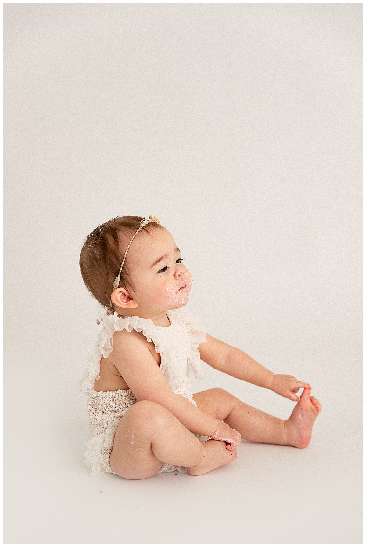 Baby girl sitting for Norma Fayak Photography