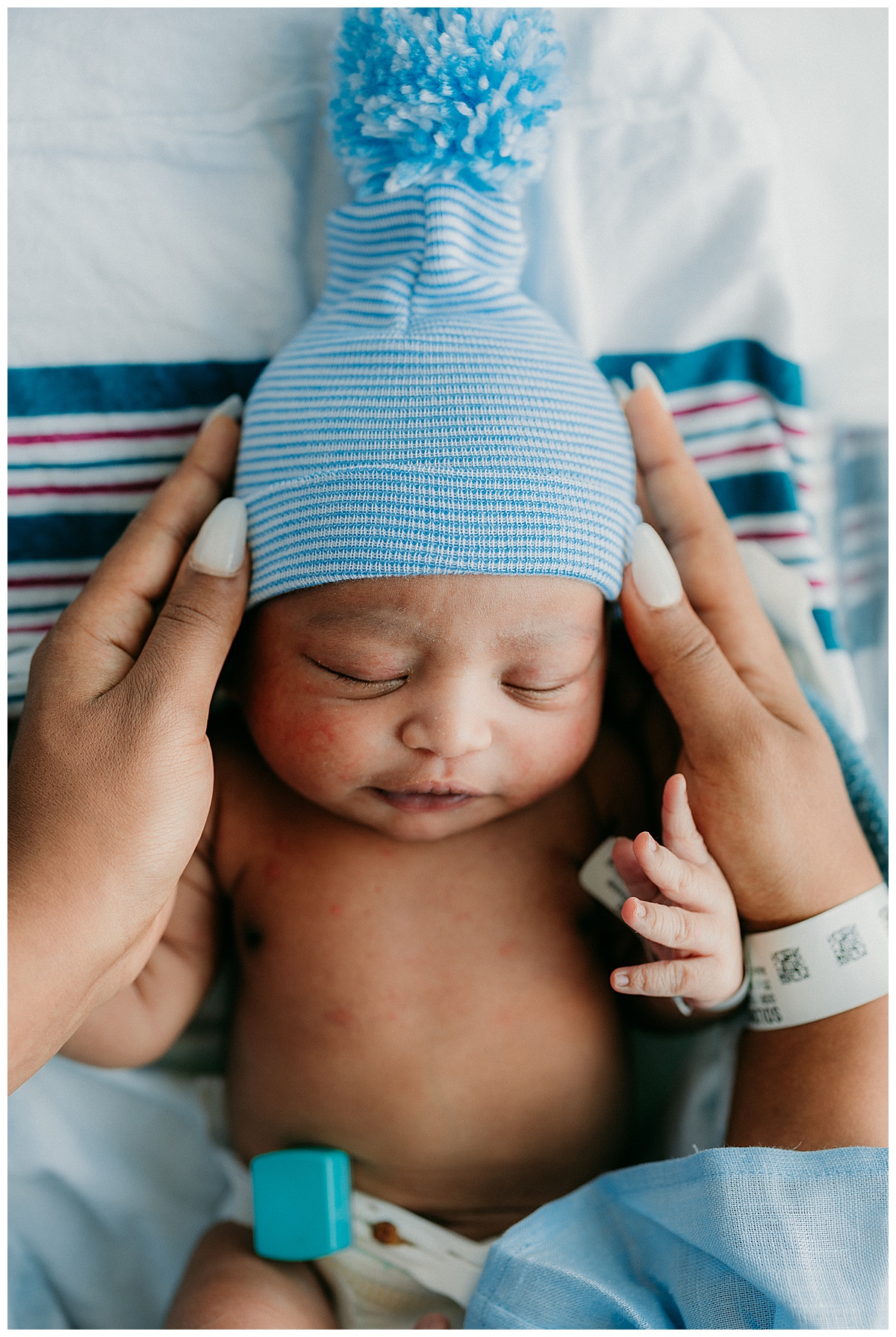 Infant wearing blue beanie hat for Fresh 48 Hospital Session