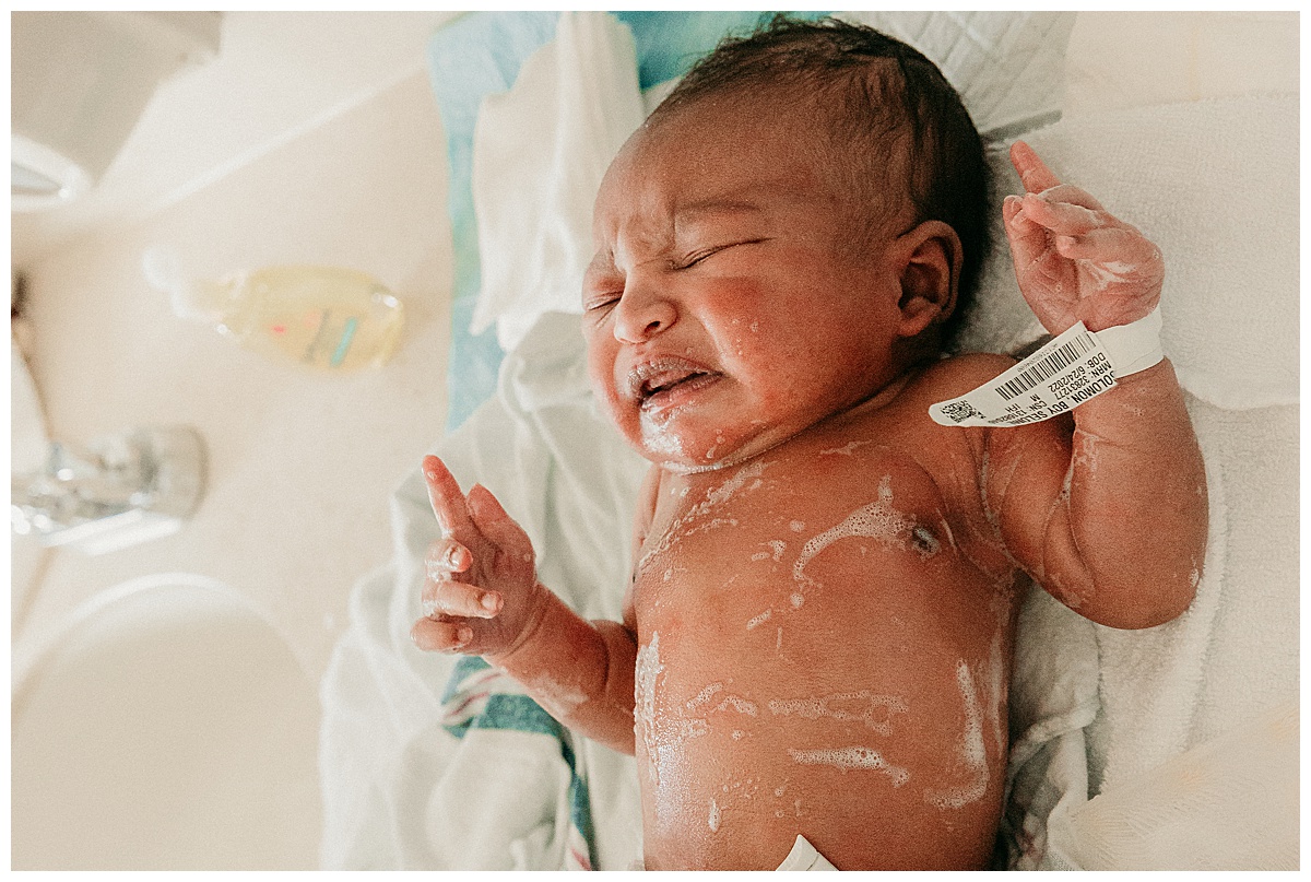 Newborn baby getting bath for Fresh 48 Hospital Session