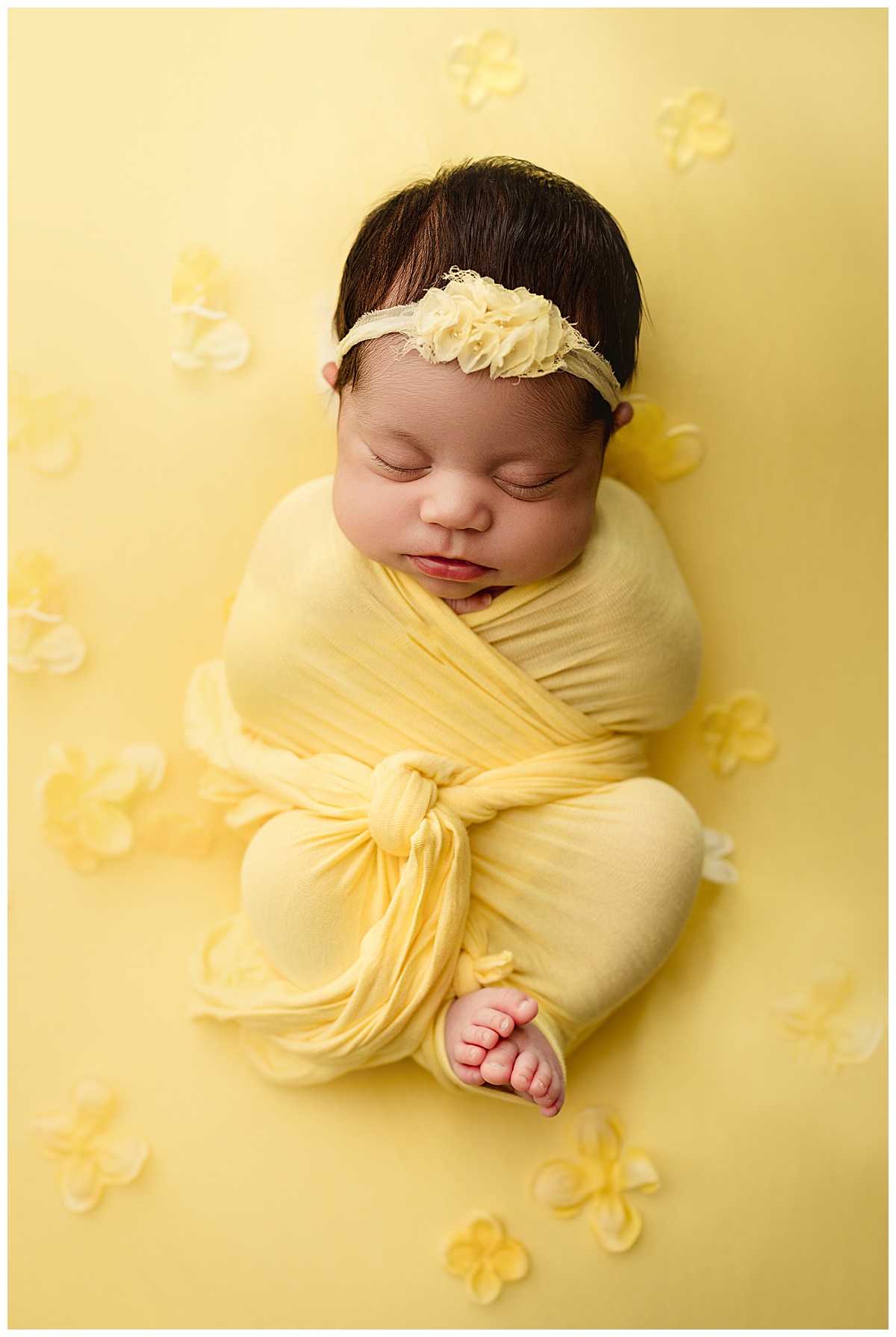 Baby wrapped in yellow for Fine Art Posed Session