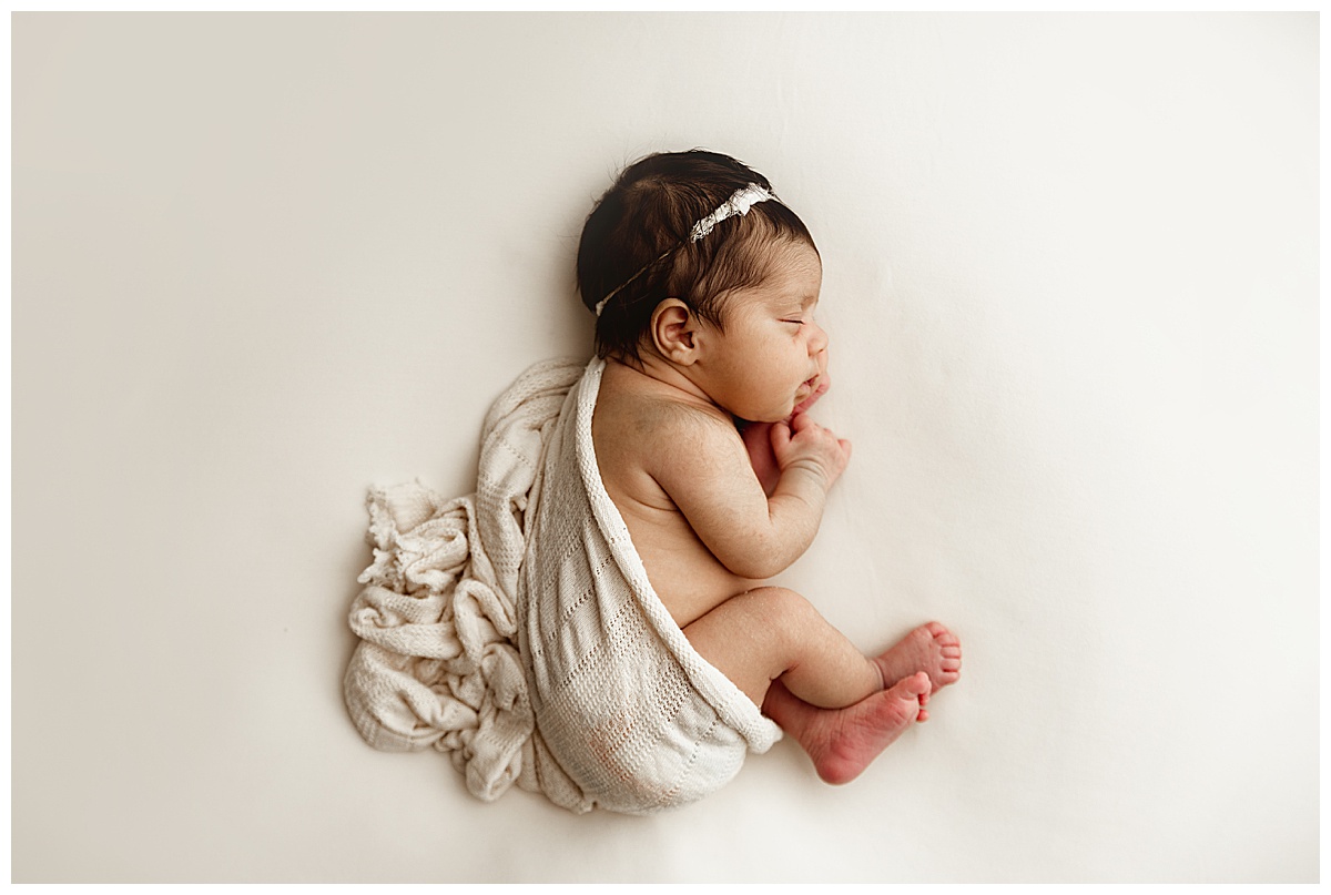 Baby laying on side for Fine Art Posed Session