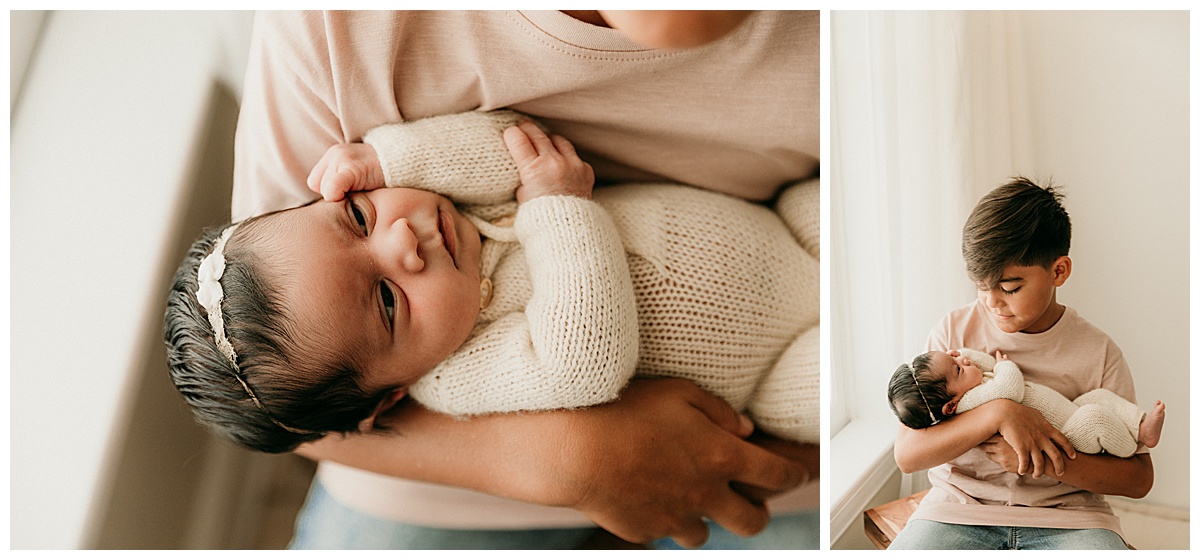 Brother holds little sister for Washington DC Newborn Photographer