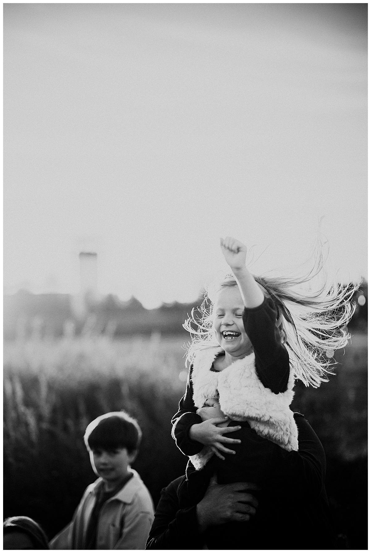 Little girl holds hand in the air for Washington DC Family Photographer