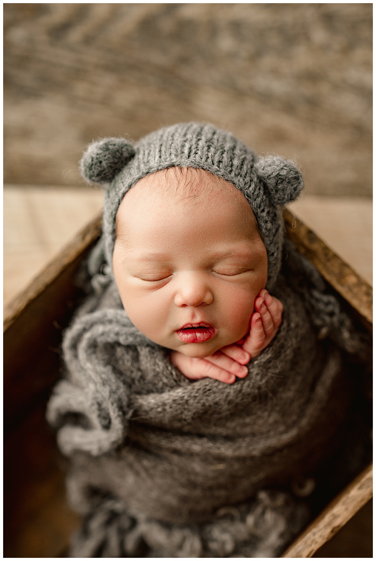 Infant wearing bear bonnet for Norma Fayak Photography