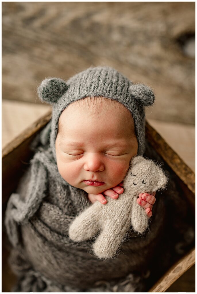 Baby in grey wrap for Norma Fayak Photography