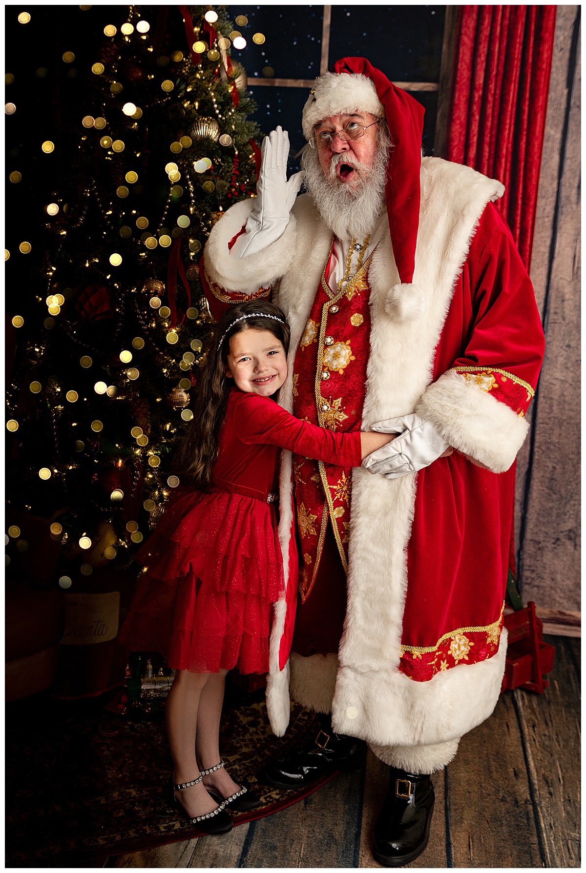 Young girl hugs Claus for Washington DC Family Photographer