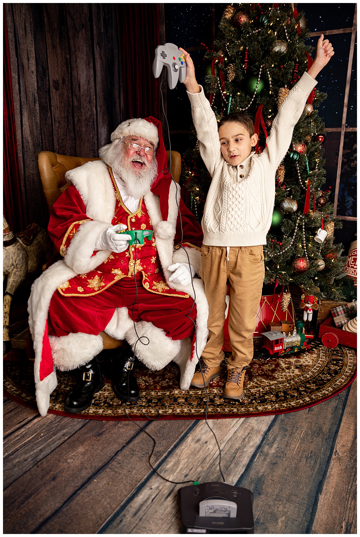 Kid plays video games with Santa for Washington DC Family Photographer