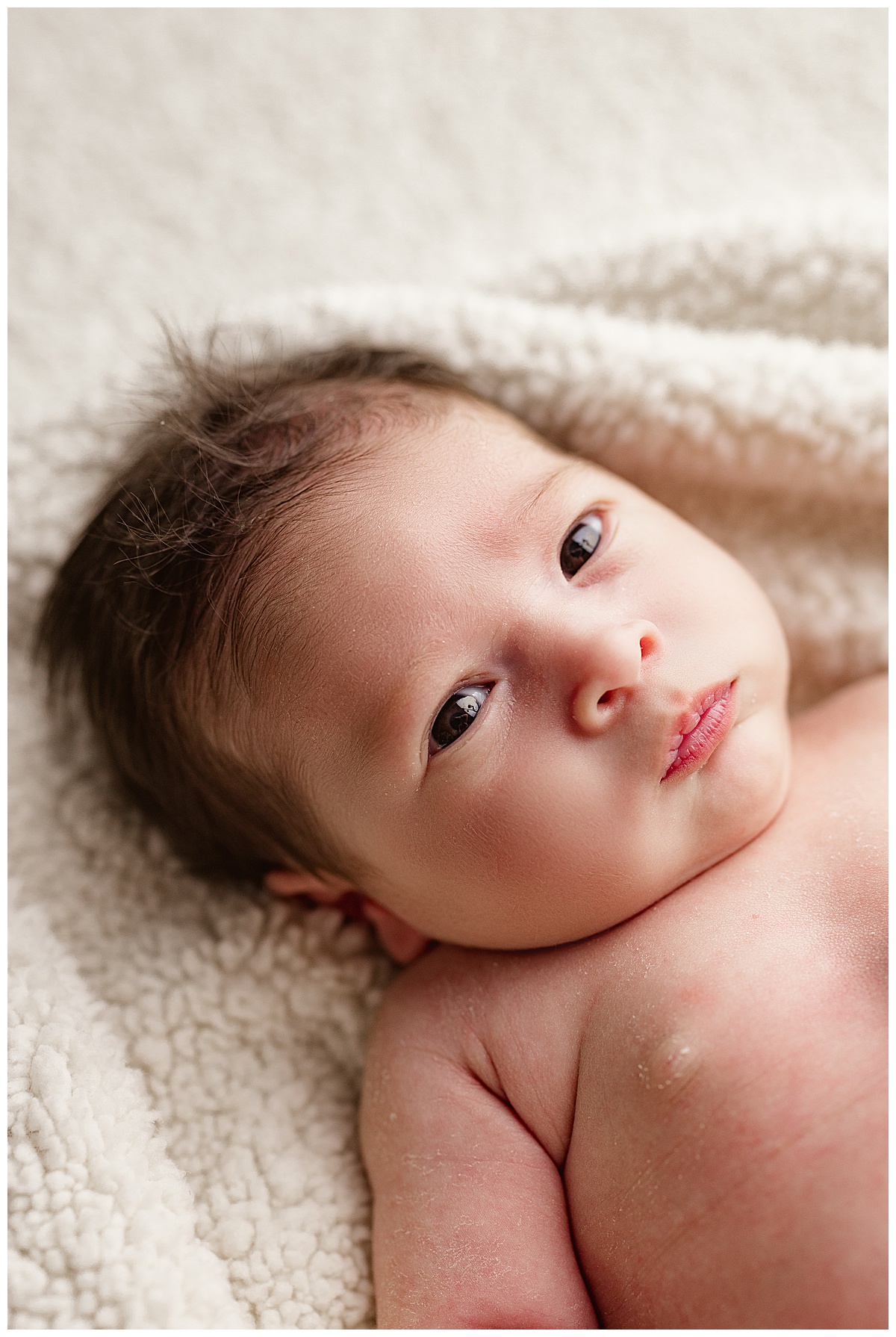 Sweet baby girl puckers lips for Virginia Newborn Photographer