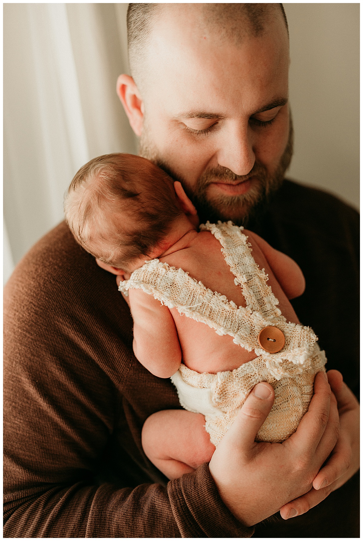 Baby lays on dads chest for Virginia Newborn Photographer 