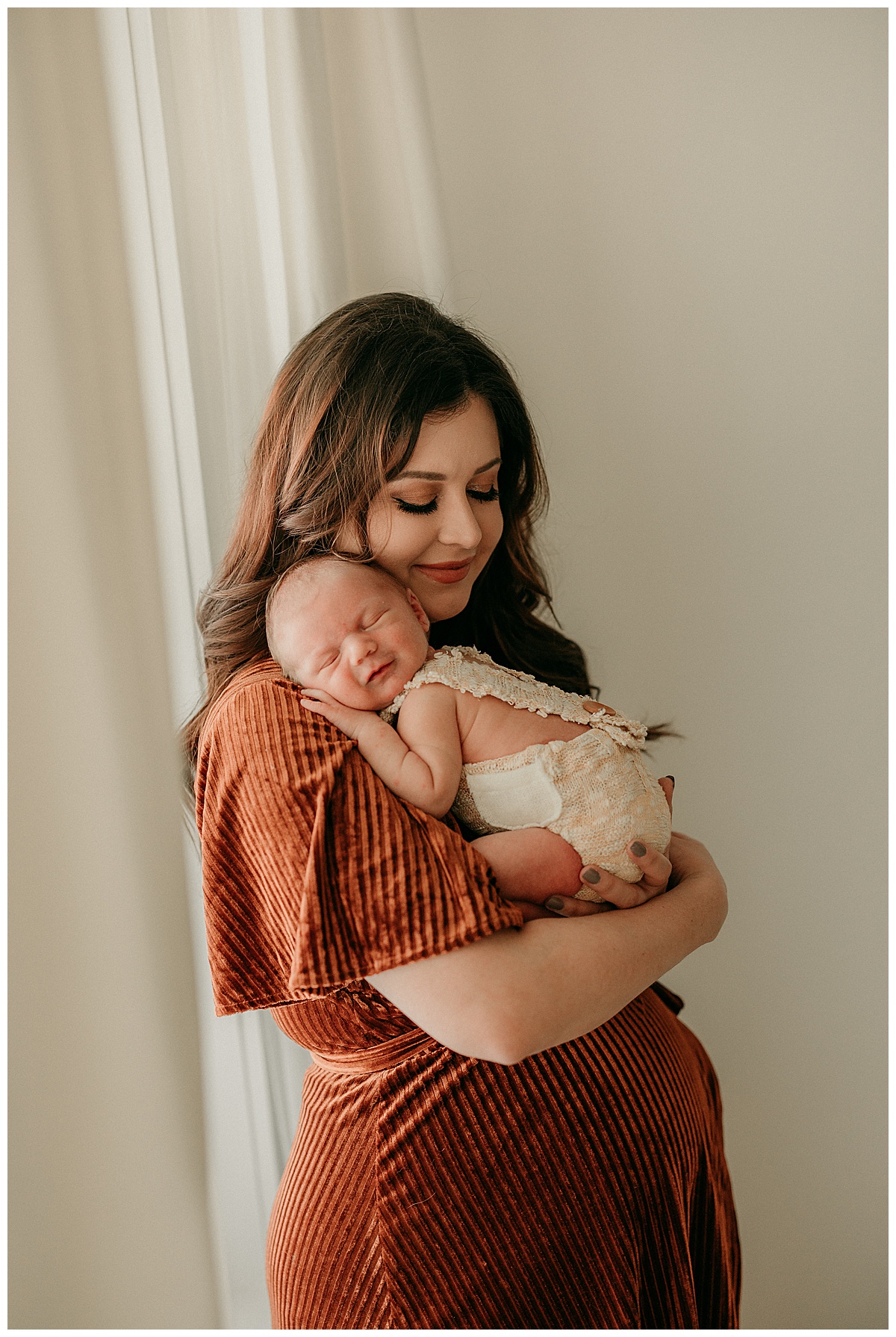 Baby lays head on shoulder with Mom for Intimate Studio Newborn Session