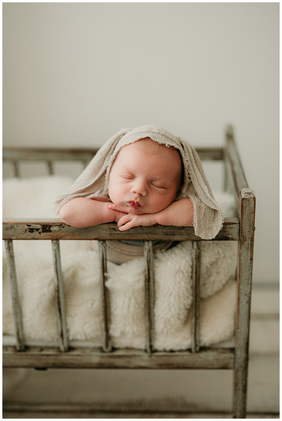 Infant leans head bassinet for Norma Fayak Photography