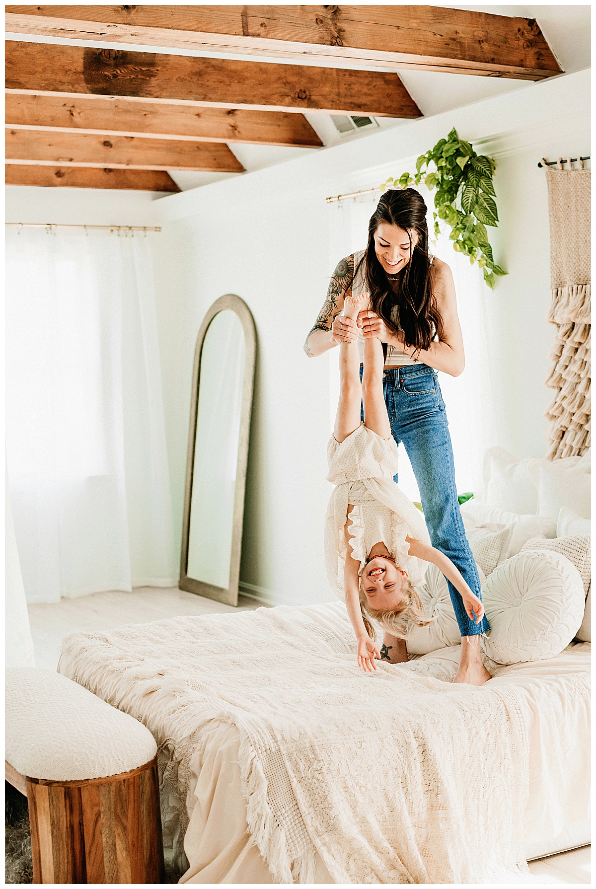 Mama and baby jump on bed for Virginia Family Photographer