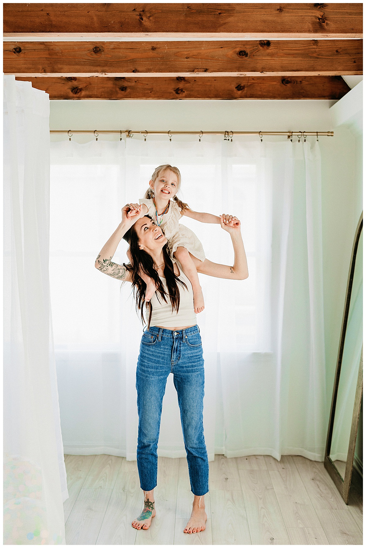 Little girl rides on Moms shoulders for Norma Fayak Photography