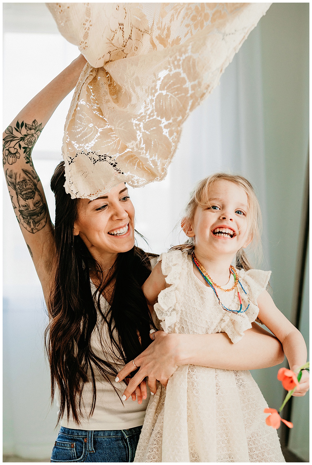 Mom smiles with daughter for Norma Fayak Photography