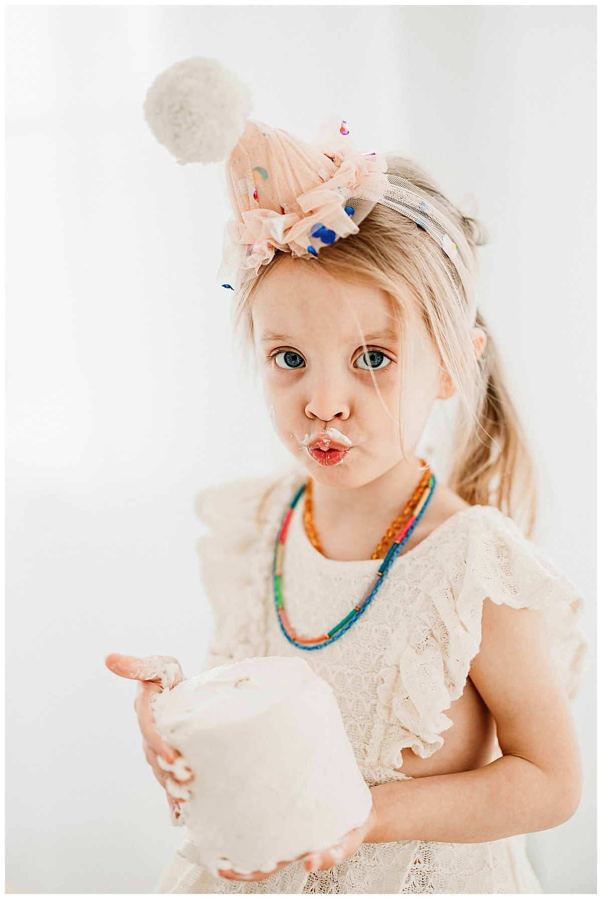 Baby girl makes a kissy face for her Birthday Session In The Studio 