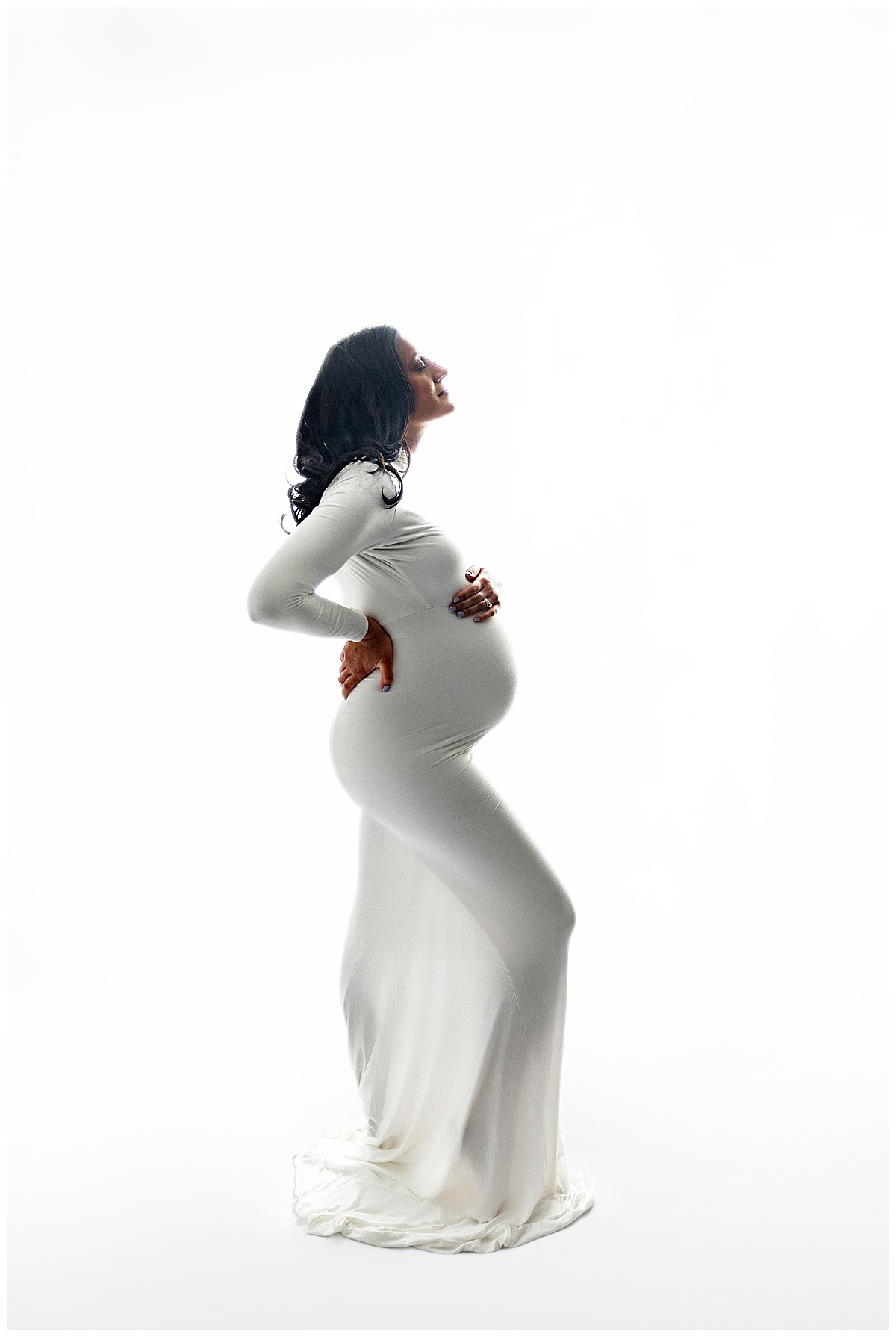 Mom holds baby bump for Norma Fayak Photography
