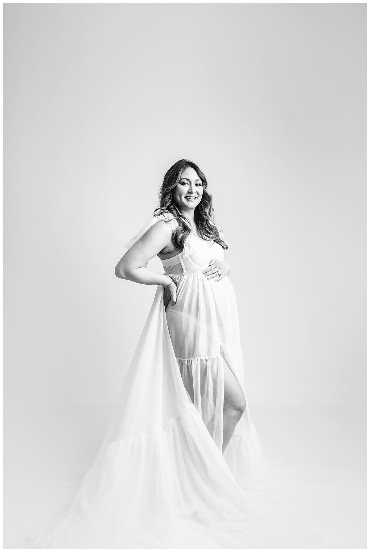 Gorgeous Mama smiles and holds bump for Norma Fayak Photography 