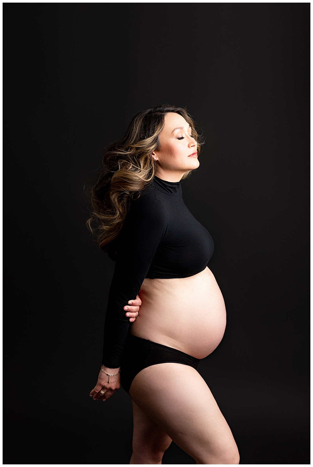 Mama smiles big in black crop top for Virginia Maternity Photographer
