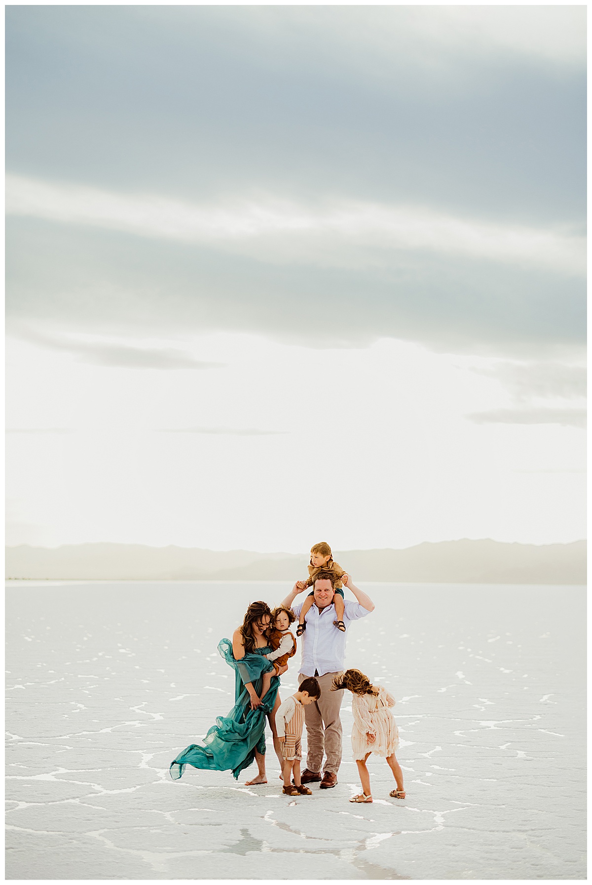 Parents stand close with their kids during Bonneville Salt Flats Family Session