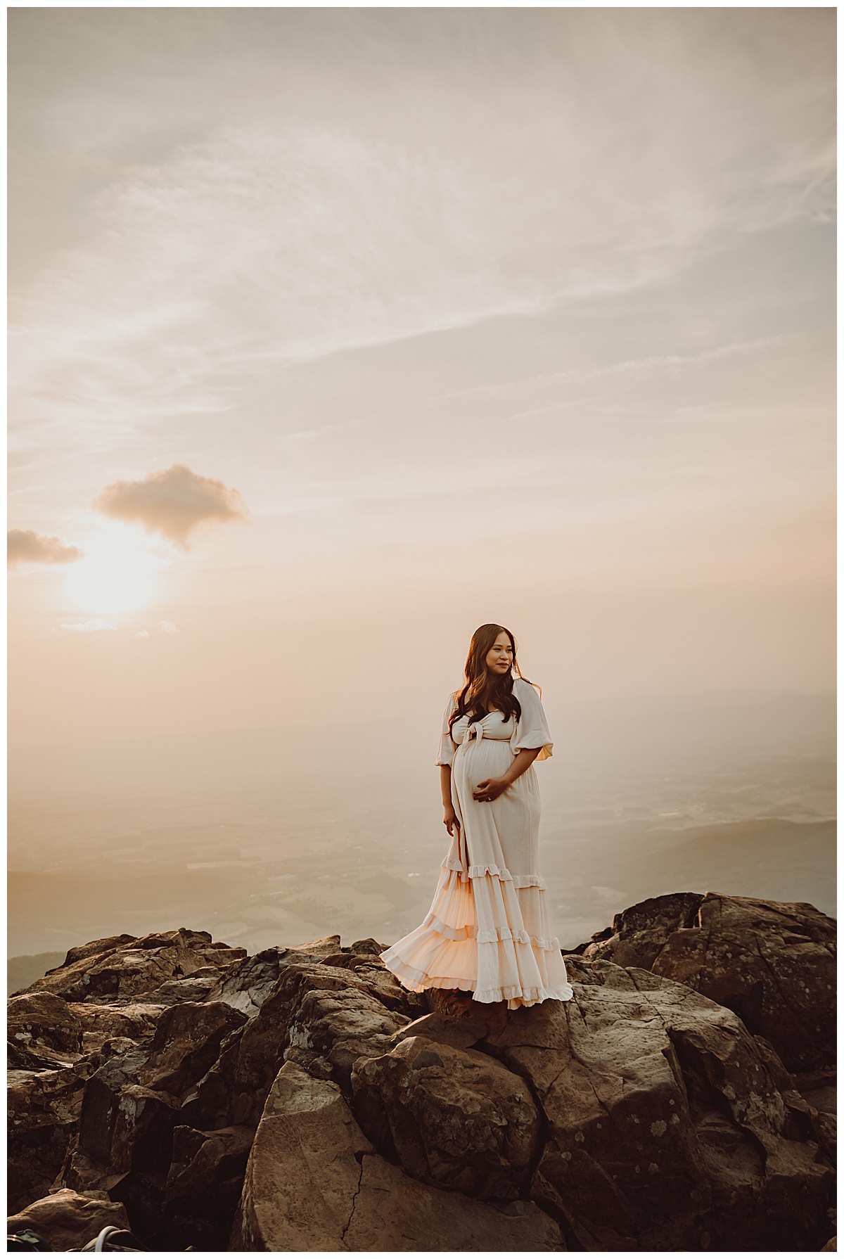 Woman holds pregnant belly for Shenandoah Mountains Adventurous Maternity Session