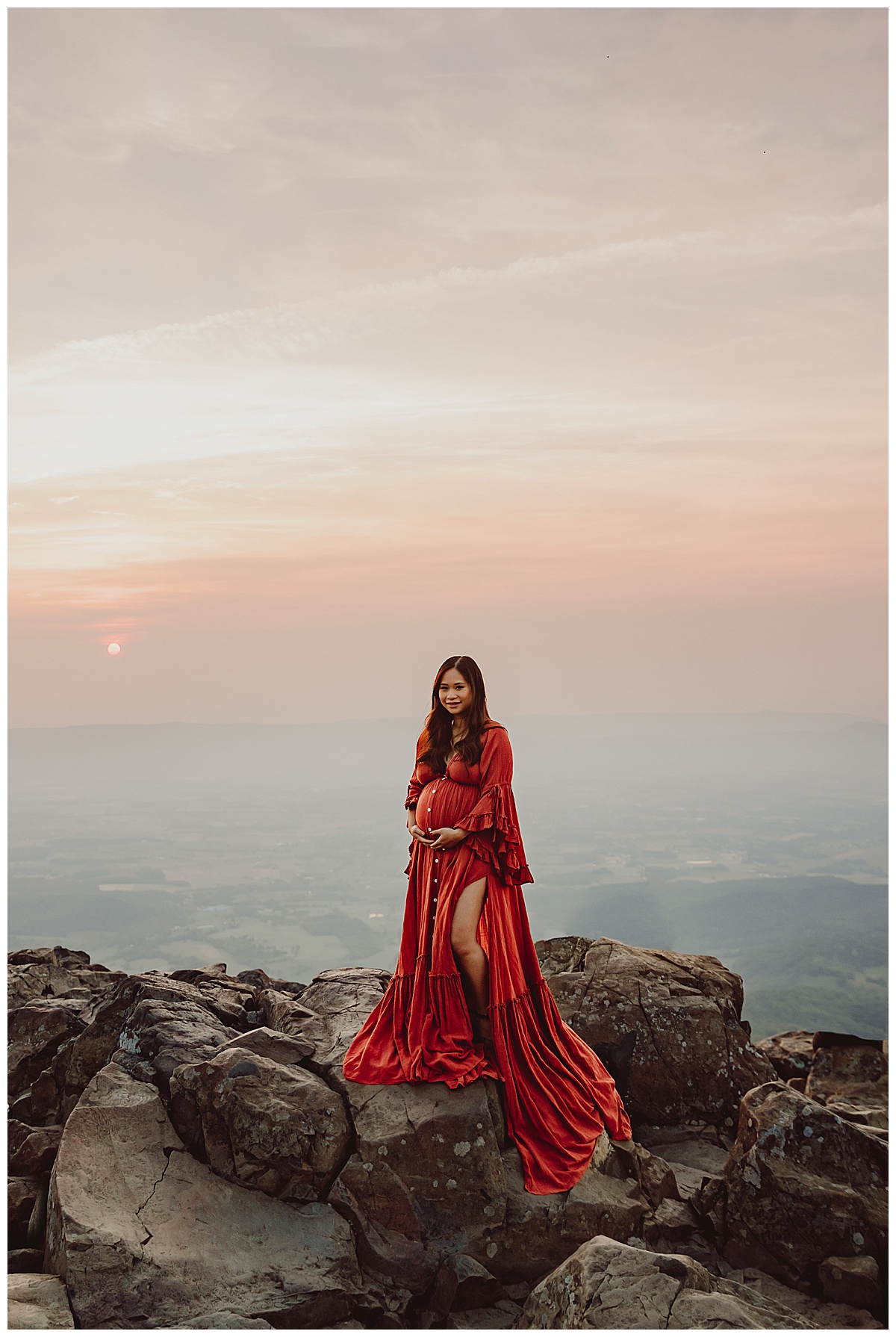 Lady stands atop a mountain for Norma Fayak Photography