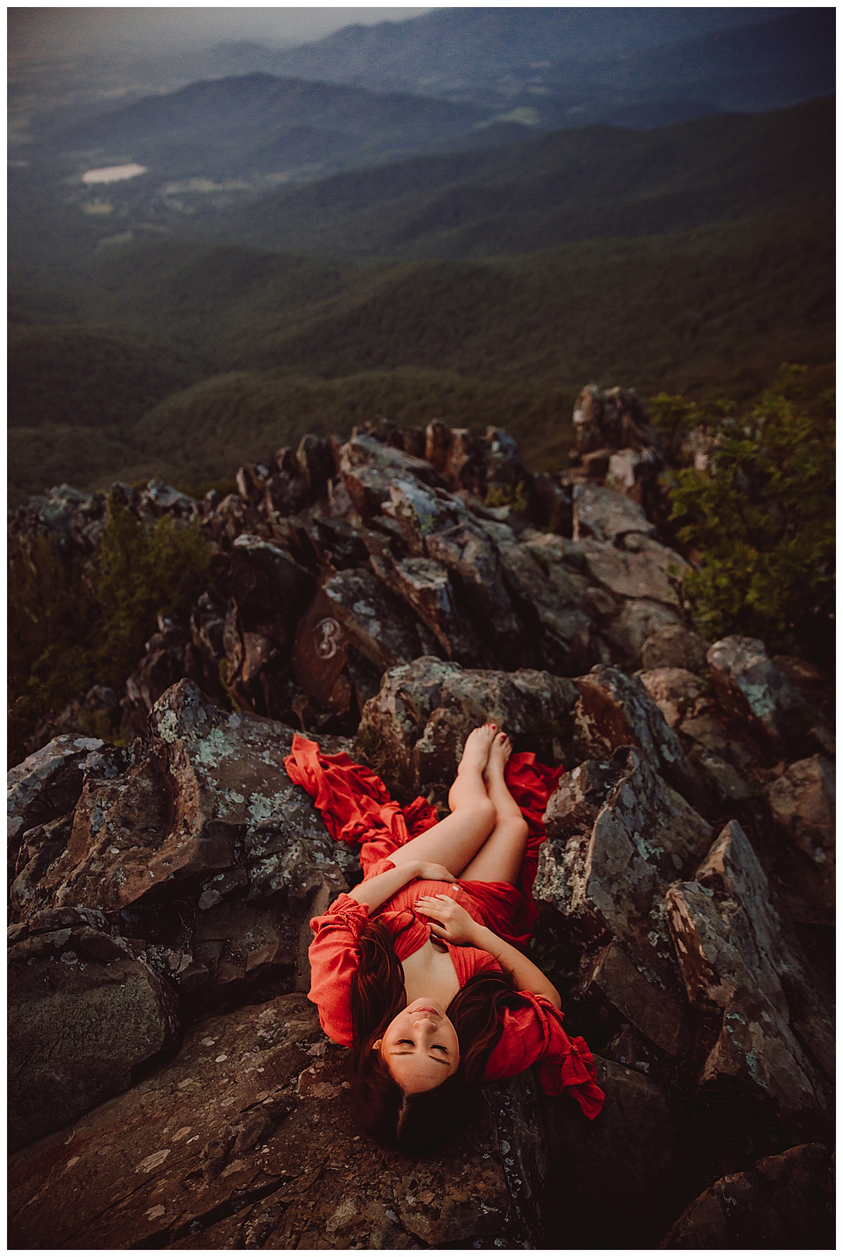 Mama embraces her pregnant belly for Shenandoah Mountains Adventurous Maternity Session