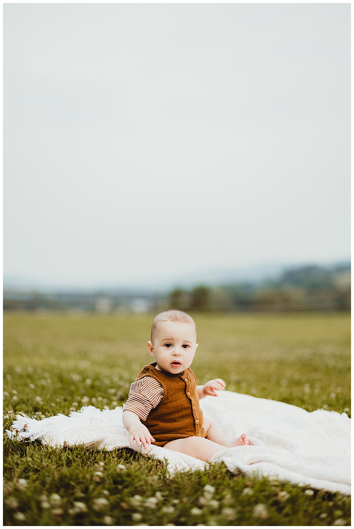 Baby sits on blanket on farm for Virginia Family Photographer