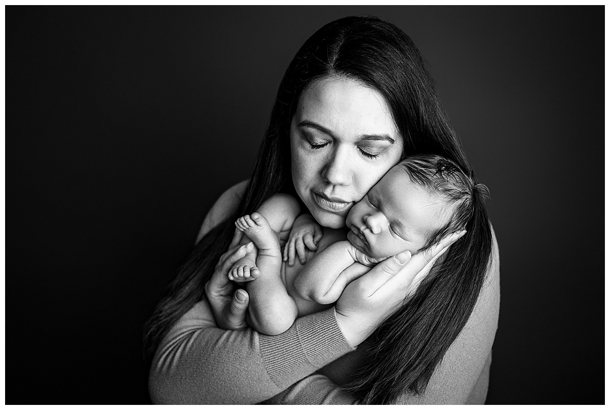 Mom loves on newborn for Norma Fayak Photography