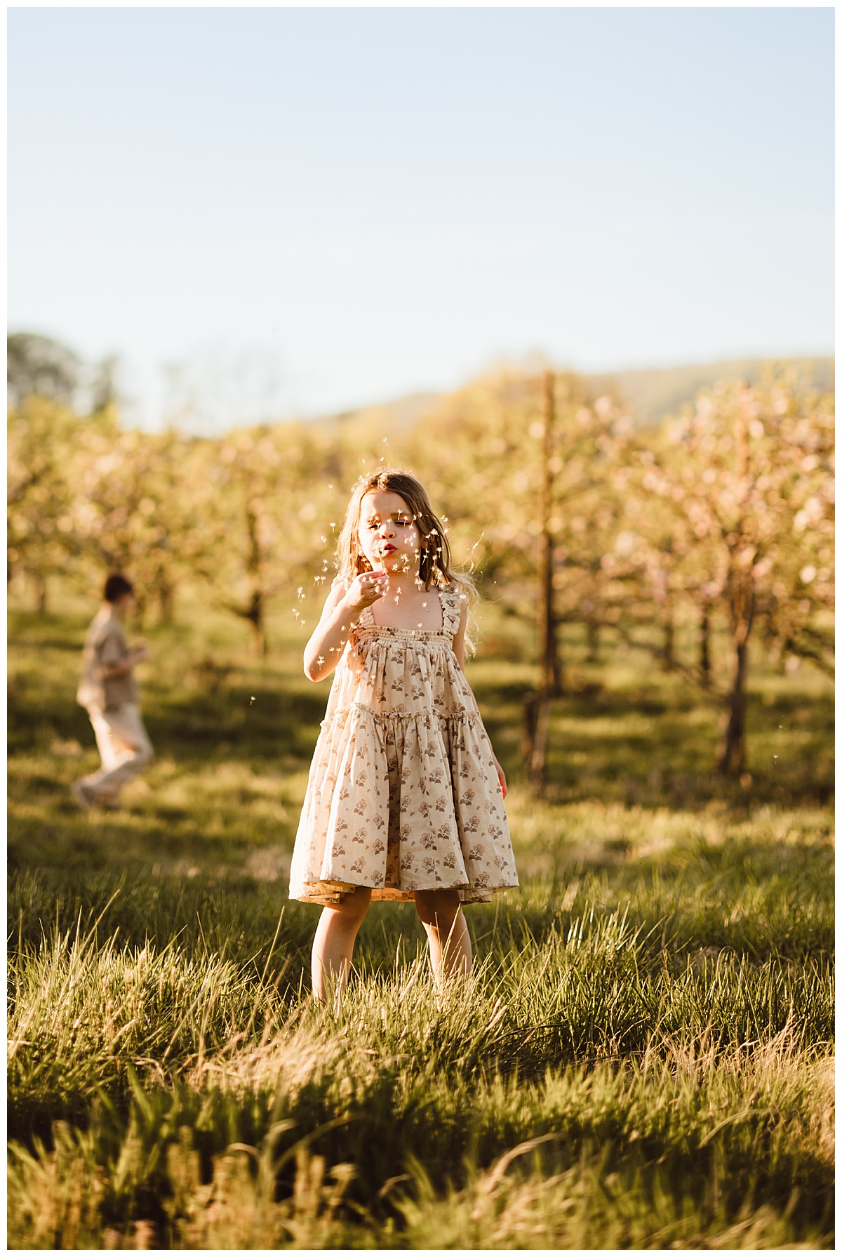 Young girls play in the grass for Virginia Family Photographer